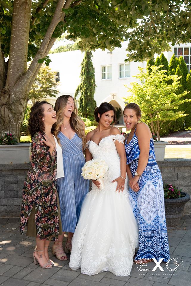 bride posing with guests