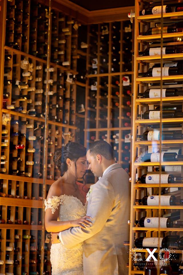 bride and groom in wine cellar at Harbor Club at Prime