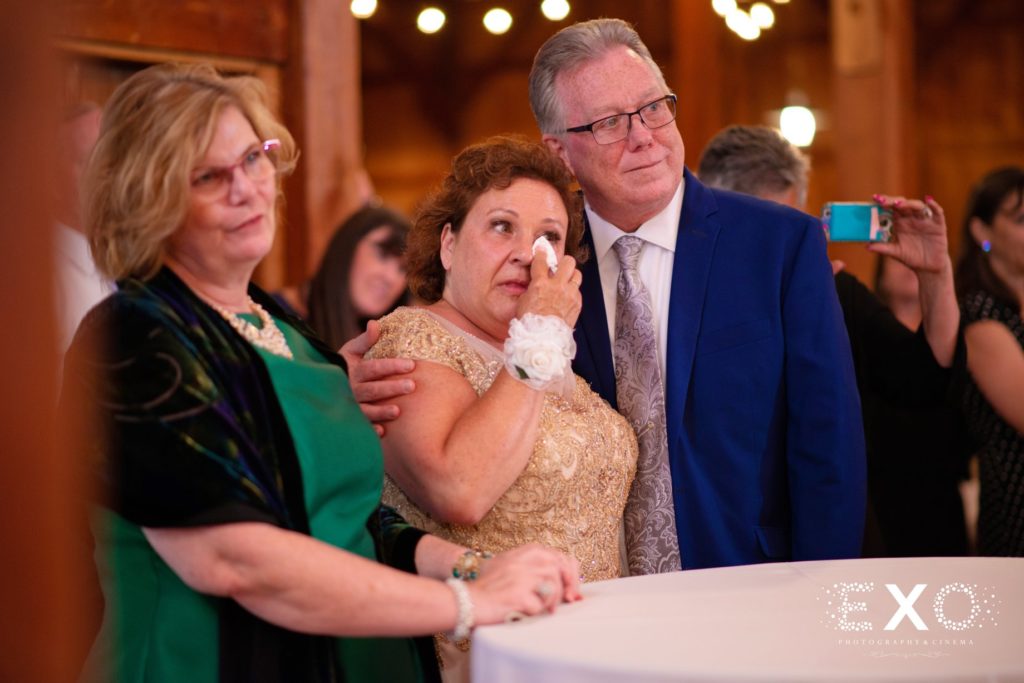 brides parents crying at reception at Old Bethpage Village Restoration