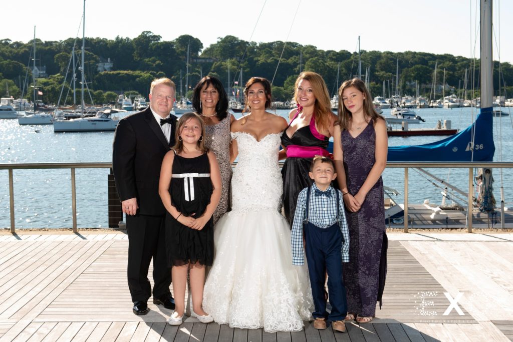 bride on dock with family