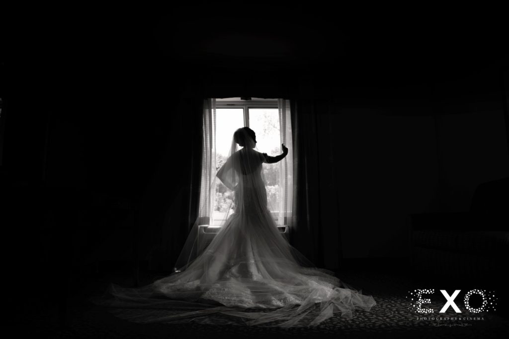 bride all dressed in window