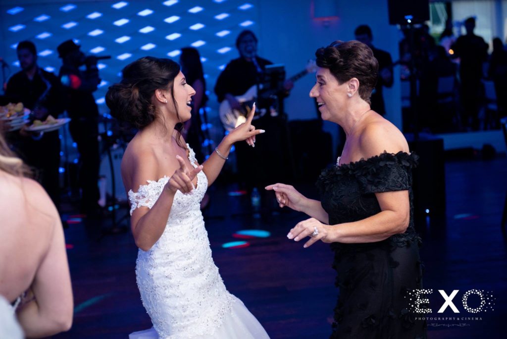 bride and mother-in-law dancing at Harbor Club at Prime