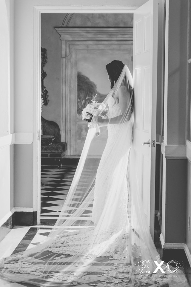 bride standing in the doorway at The Mansion at Oyster Bay