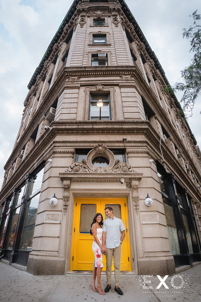 couple in front of yellow door