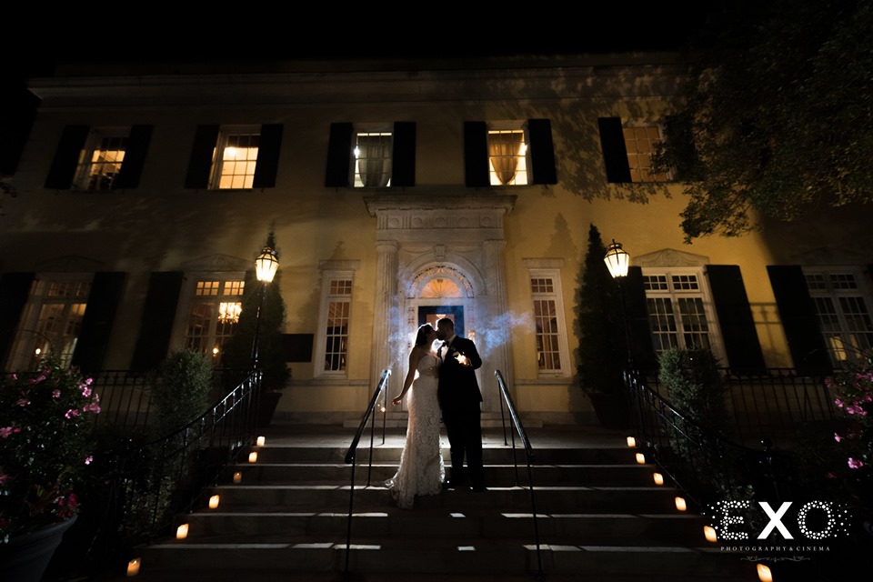 bride and groom outside The Mansion at Oyster Bay at night