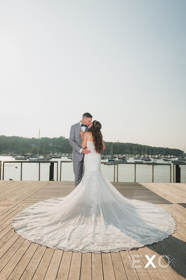 stunning bride and groom outside Harbor Club at Prime