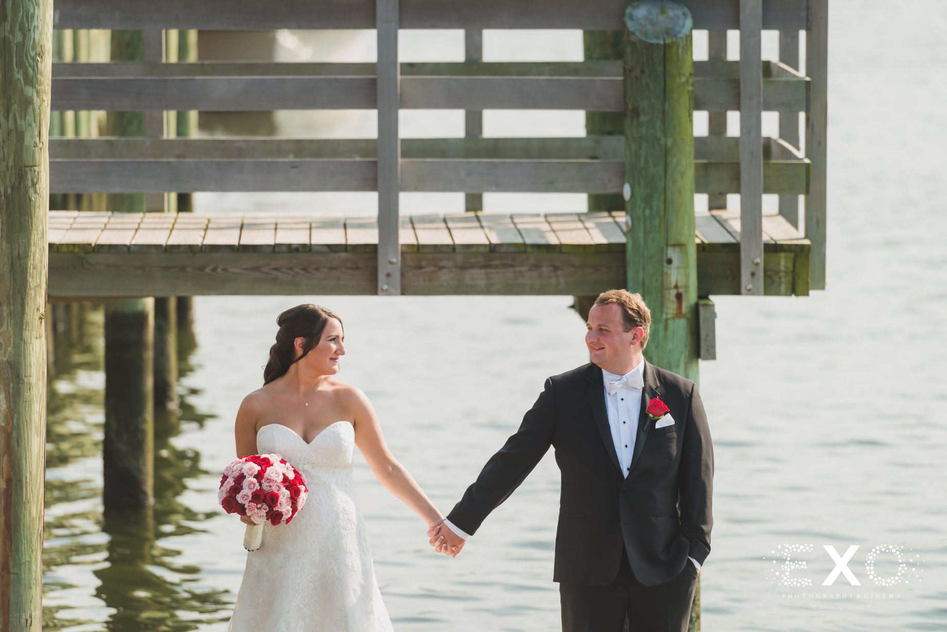 bride and groom by the water at Harbor Club at Prime