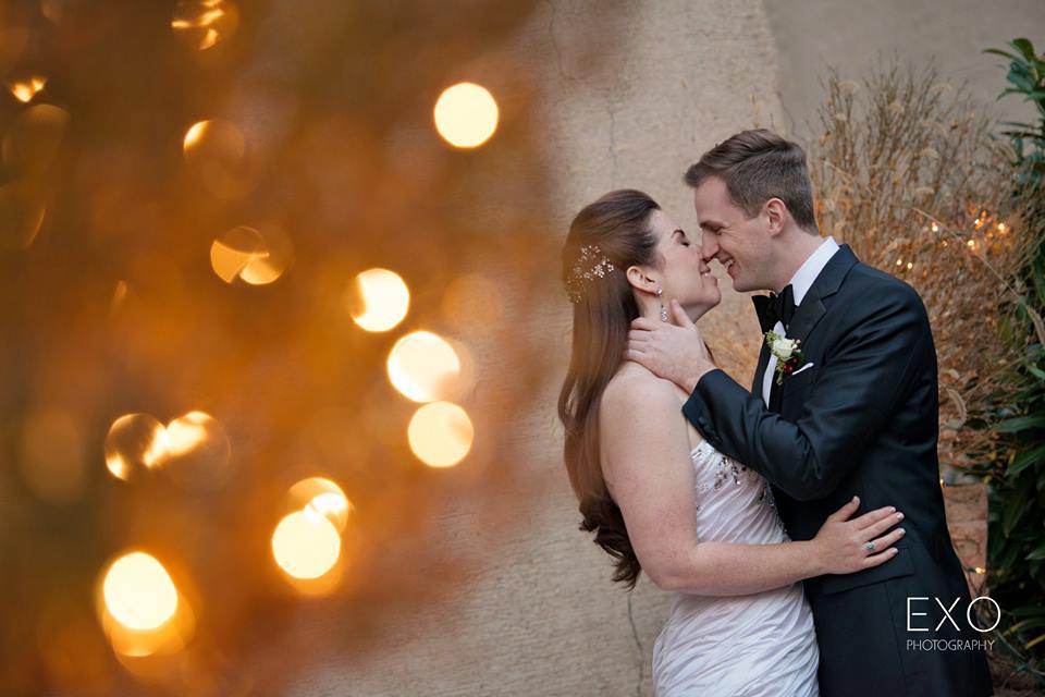 bride and groom kissing outside Coindre Hall