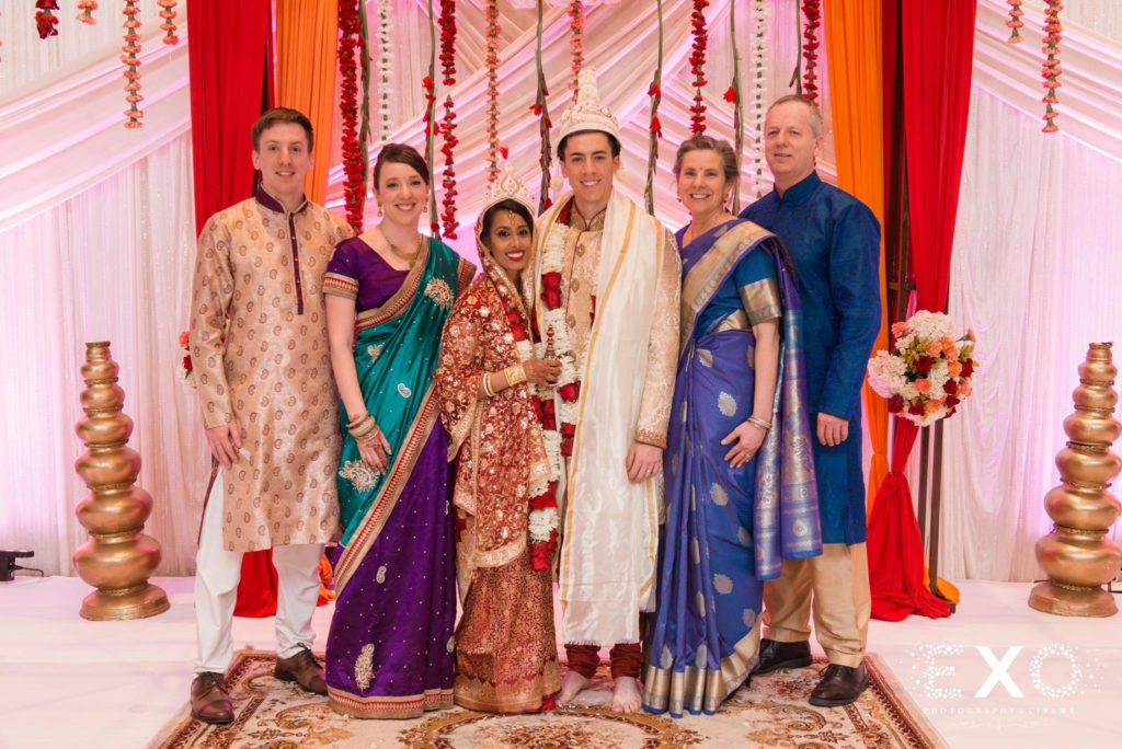 bride and groom with groom's family at Huntington Hilton