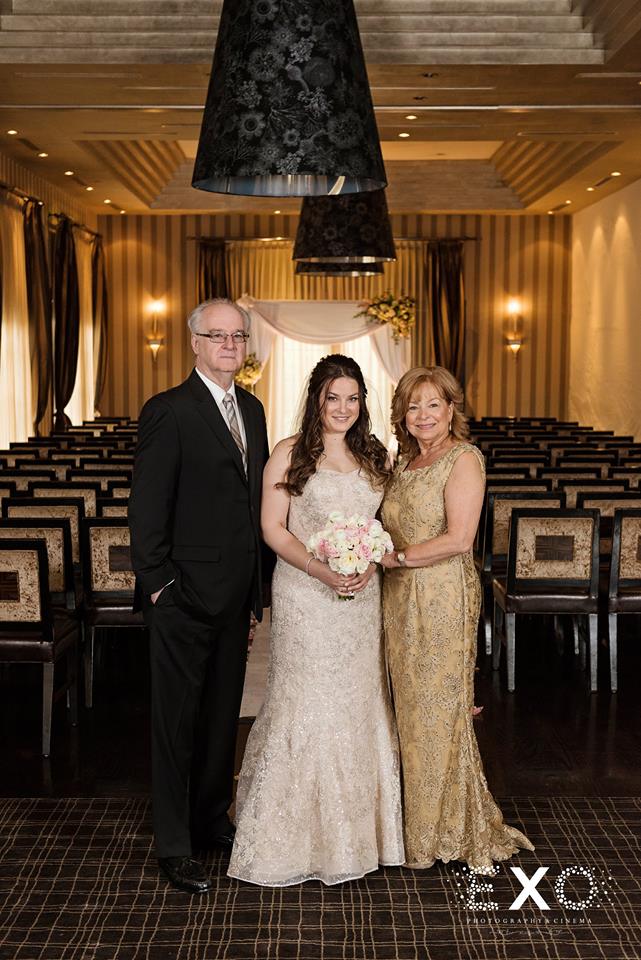 bride with parents at Insignia Steakhouse