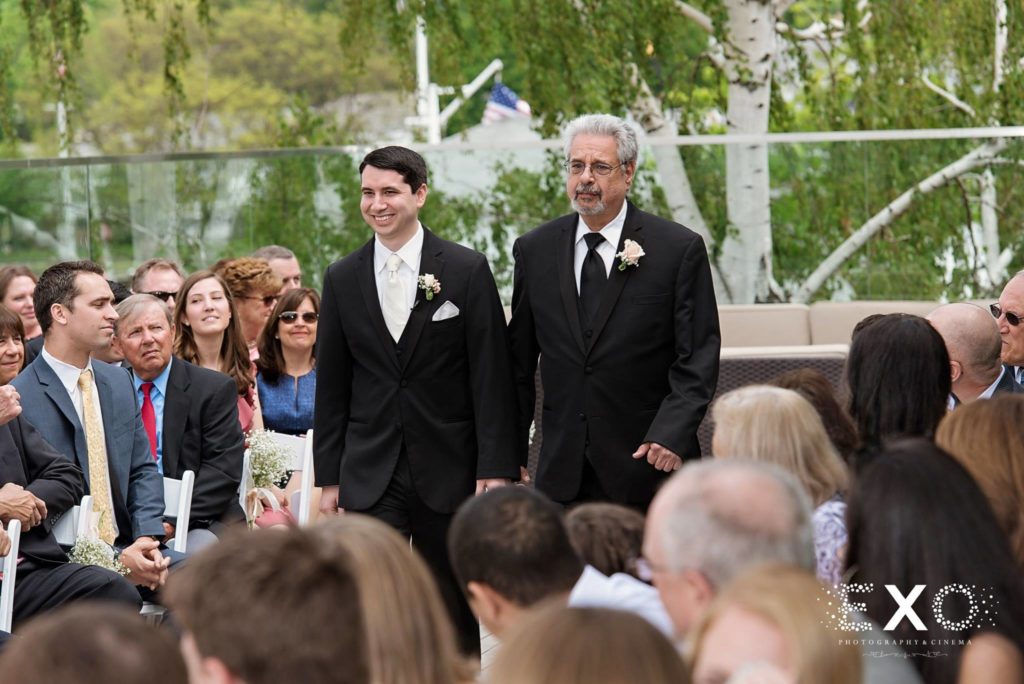 groom and father walking down the aisle at Harbor Club at Prime