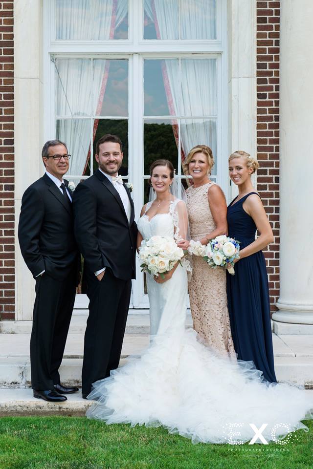 bride and groom with bride's family outside NYIT de Seversky Mansion