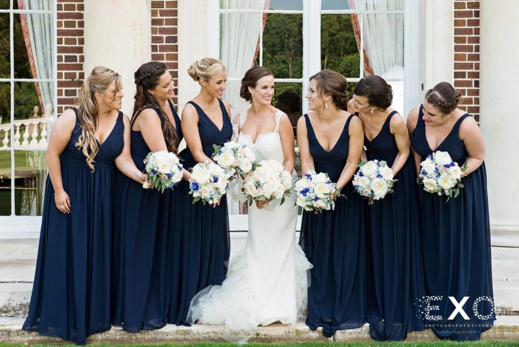 bride with her bridesmaids outside of NYIT de Seversky Mansion