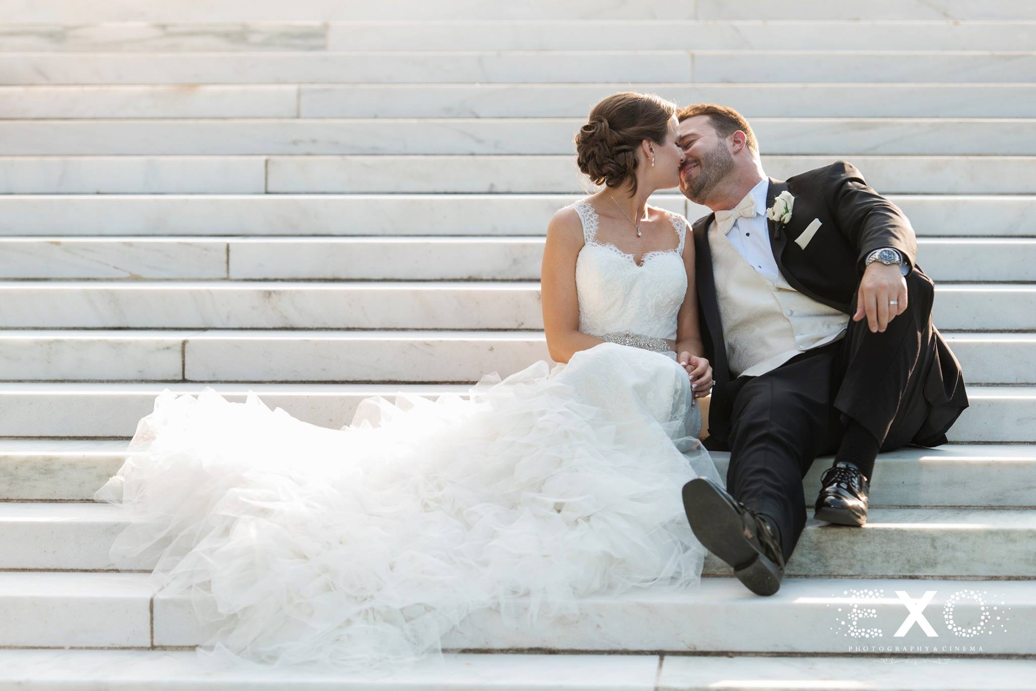 bride and groom on the steps of NYIT de Seversky Mansion