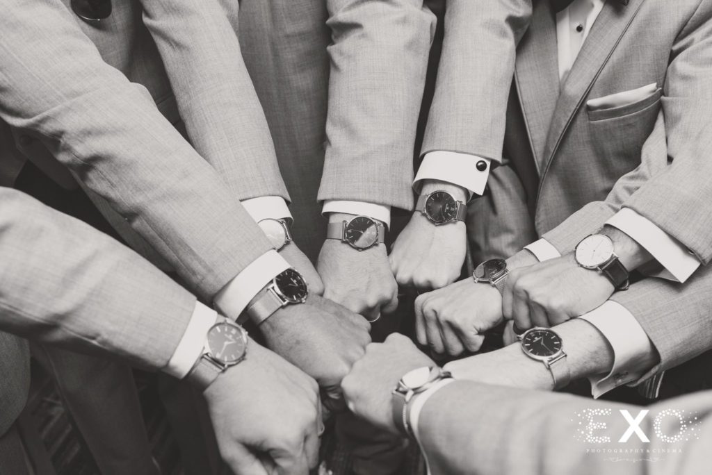 groomsmen showing off their watches