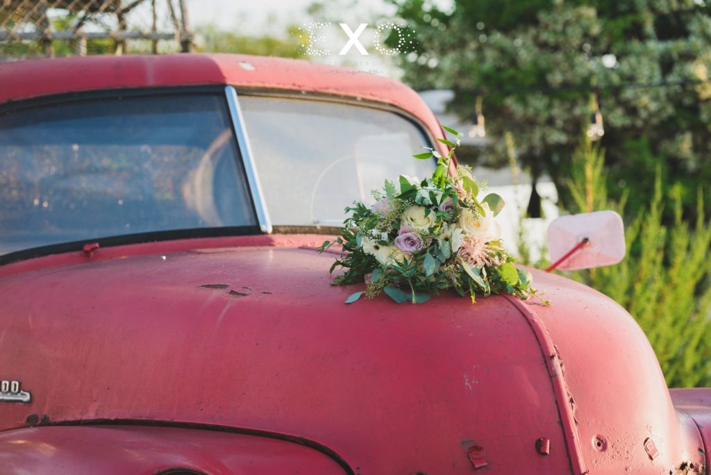 bride's bouquet on top of the car