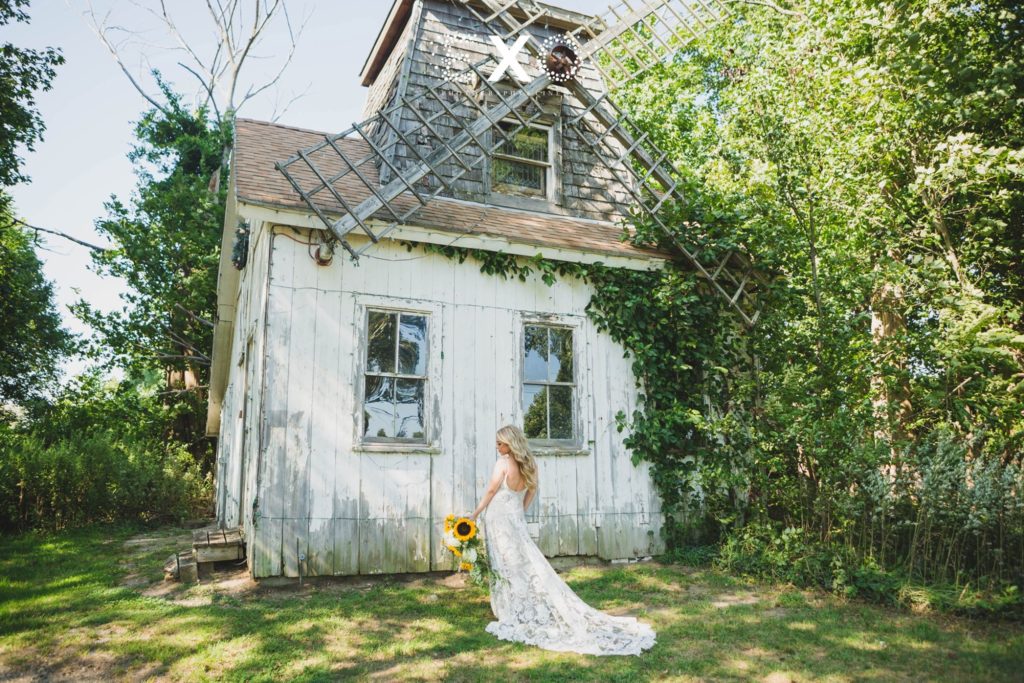 bride posing by the windmill at Giorgio's Baiting Hollow