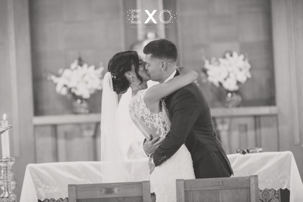 bride and groom kissing "I do"
