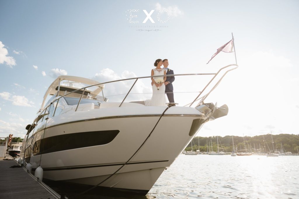 bride and groom on a yacht at Harbor Club at Prime