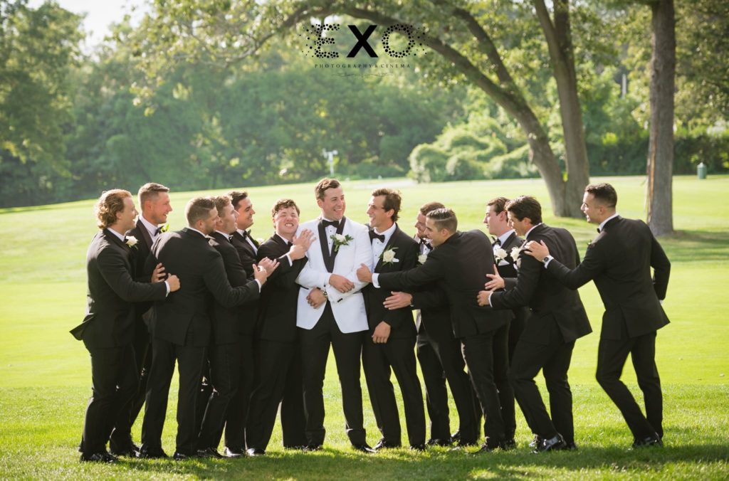 groom and groomsmen outside Muttontown Country Club