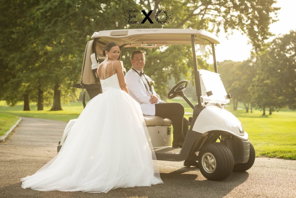 bride and groom on a golf cart at Muttontown Country Club