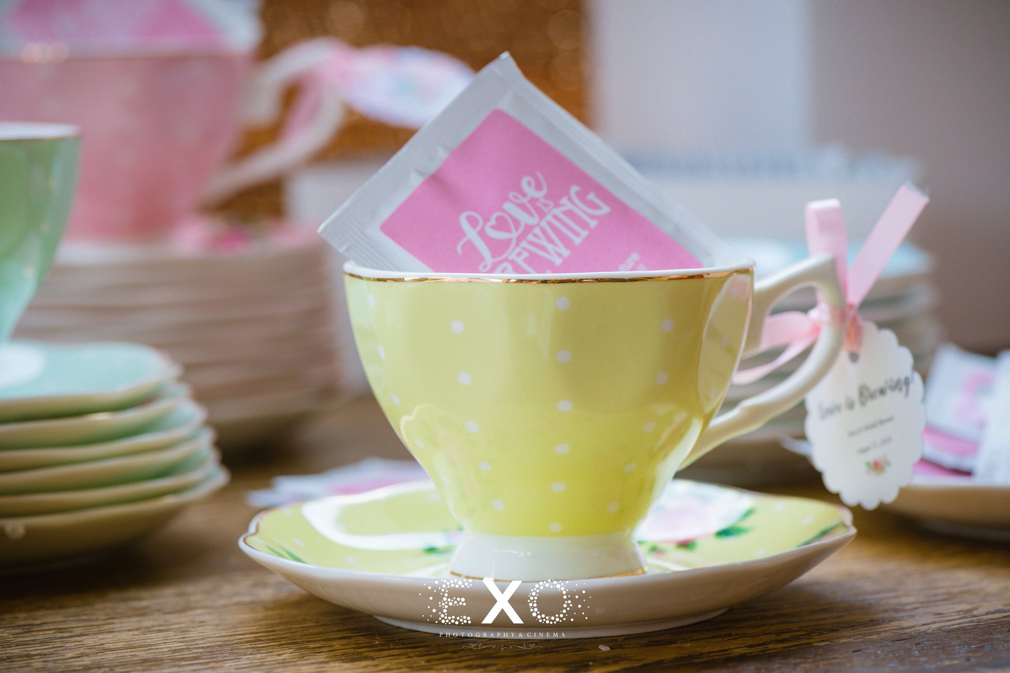 yellow teacup with "love" brewing