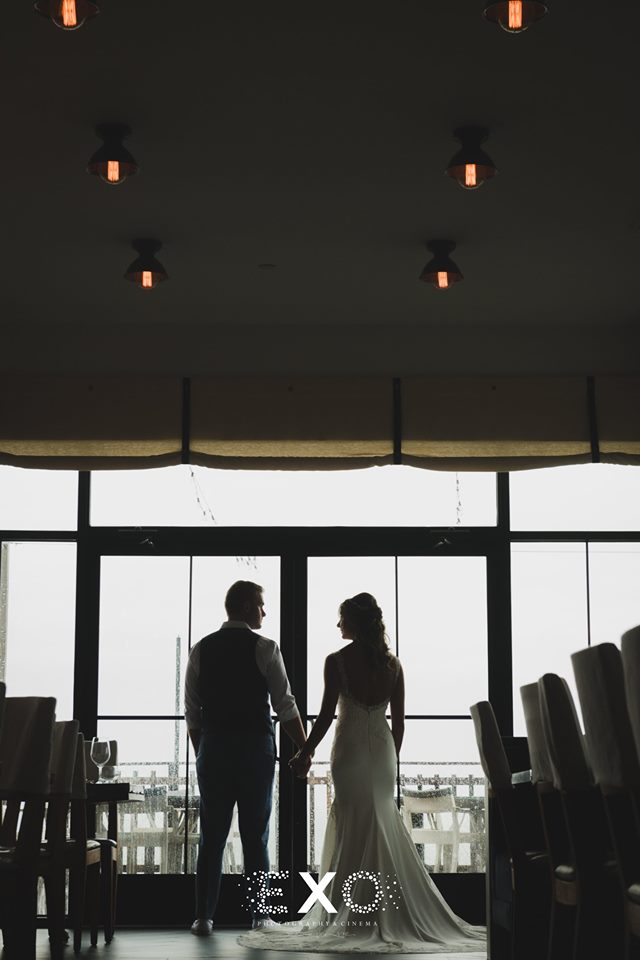 bride and groom standing in the ballroom at Gurney's Montauk Resort