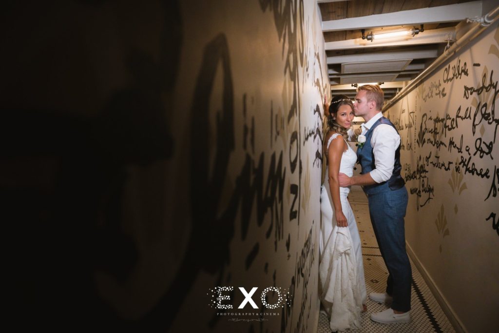 bride and groom in hallway at Gurney's Montauk Resort