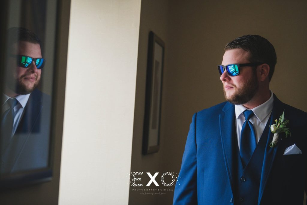 groom in sunglasses waiting for his big day to start