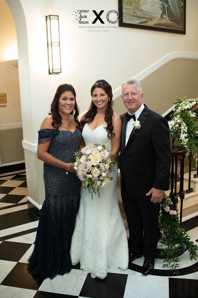 bride and her parents inside The Mansion at Oyster Bay