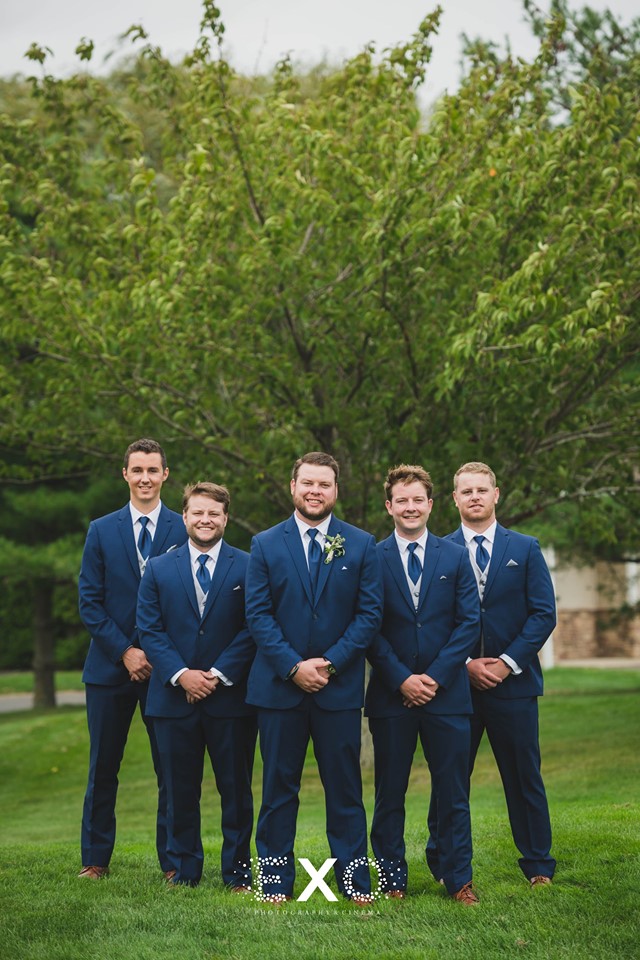 groom and groomsmen posing outside Willow Creek Golf and Country Club