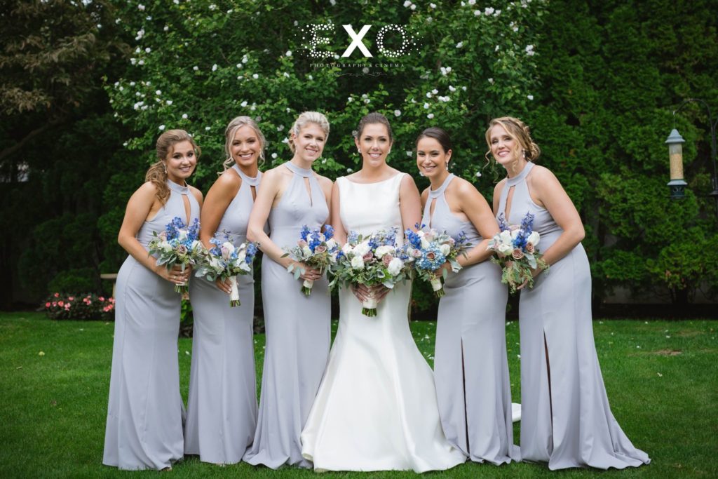 bride and her bridesmaids with their bouquets