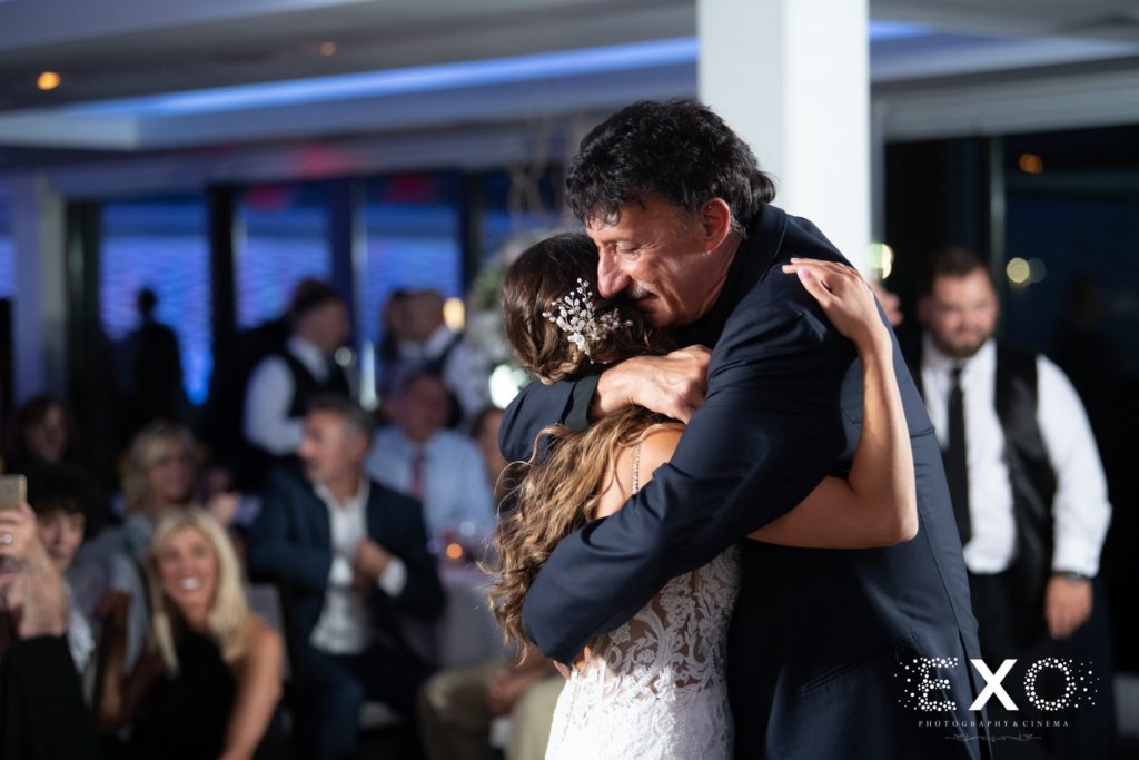 bride hugging her father during their dance