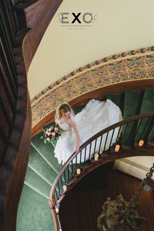 bride walking down the stairs at Coindre Hall