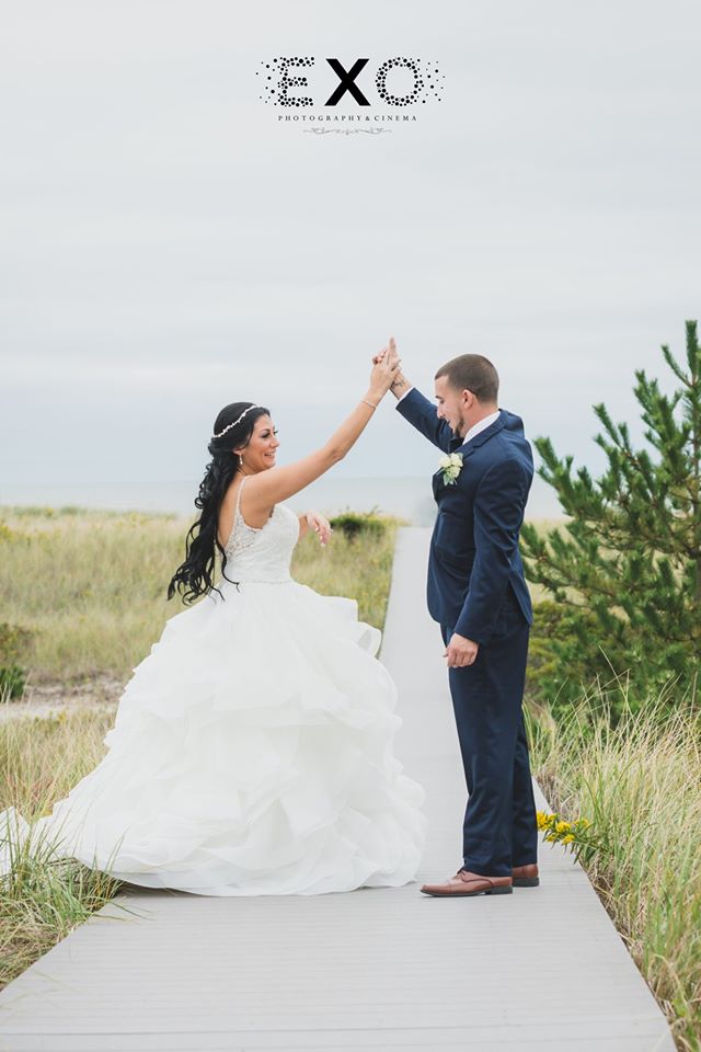 bride and groom dancing on the boardwalk