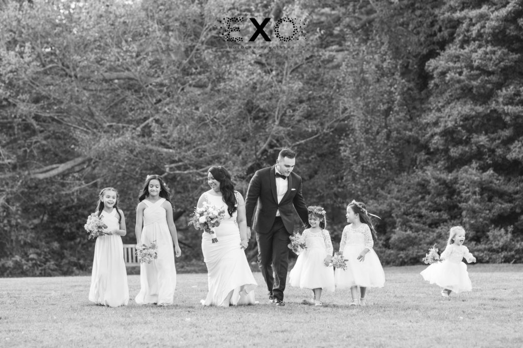 bride and groom walking with the children at Fox Hollow