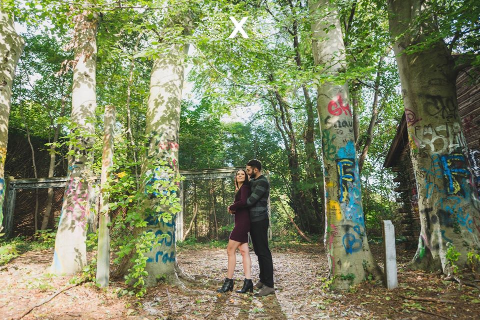 couple standing between graffiti trees at Welwyn Preserve County Park