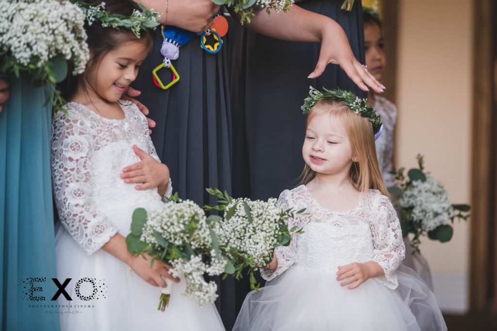 adorable flower girls holding bouquets at Fox Hollow