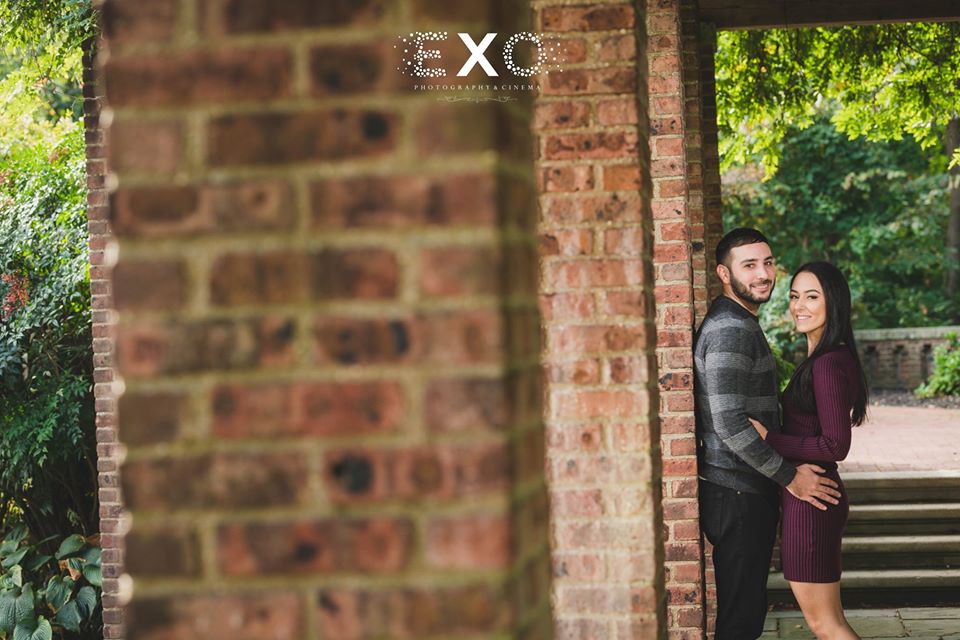 couple posing against building at Welwyn Preserve County Park