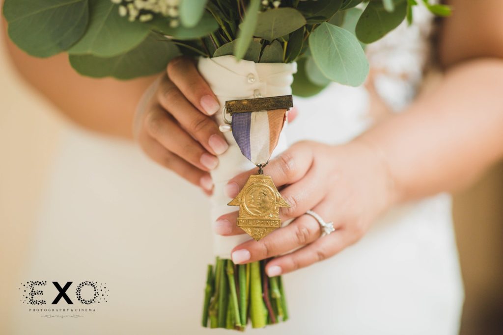 bride's pin on her bouquet