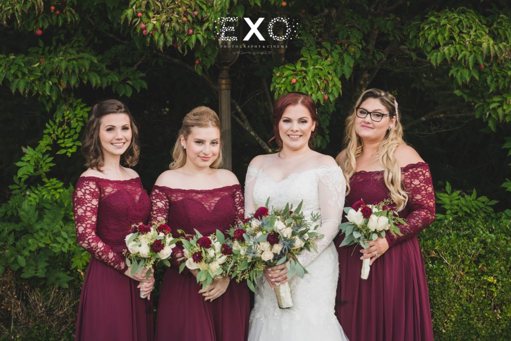 bride and bridesmaids outside Crest Hollow Country Club