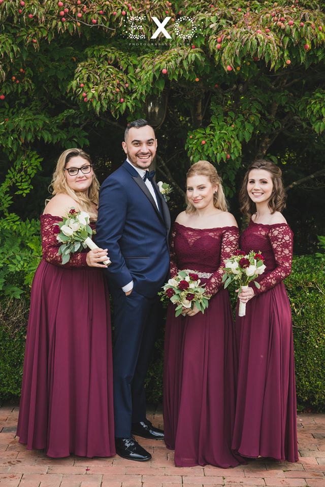 groom with his sisters outside Crest Hollow Country Club