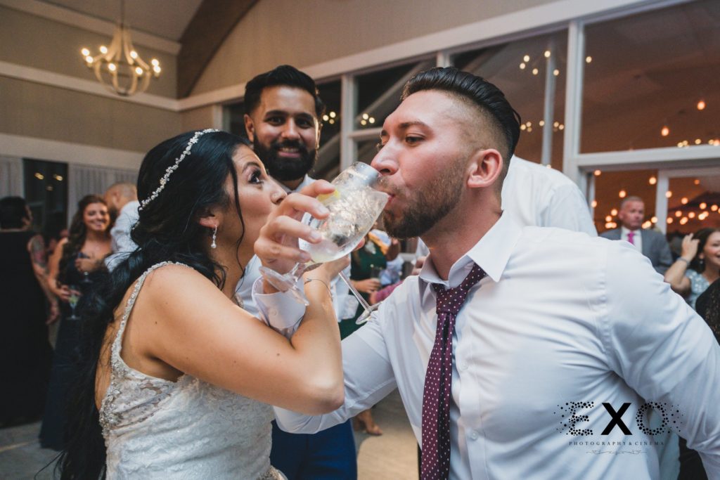 bride drinking with guests