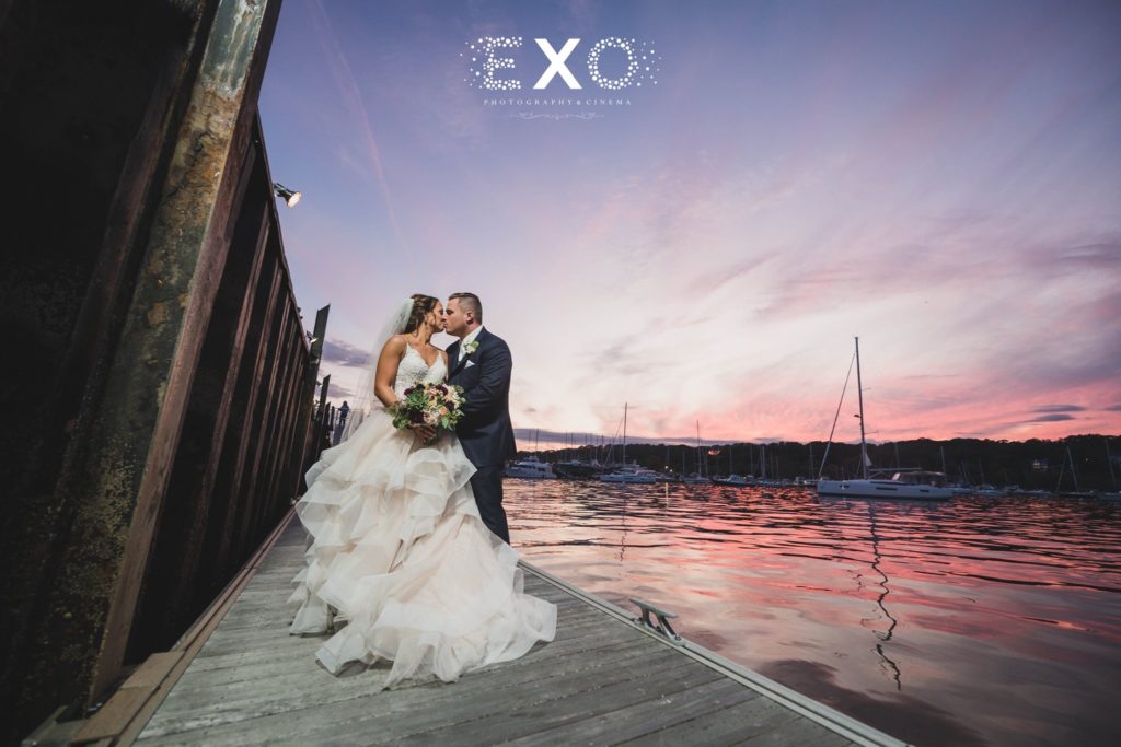 bride and groom on dock at Harbor Club at Prime