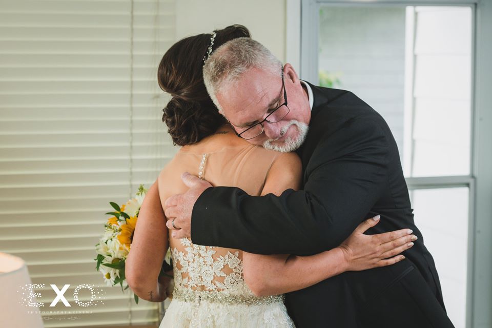 bride and her father hugging