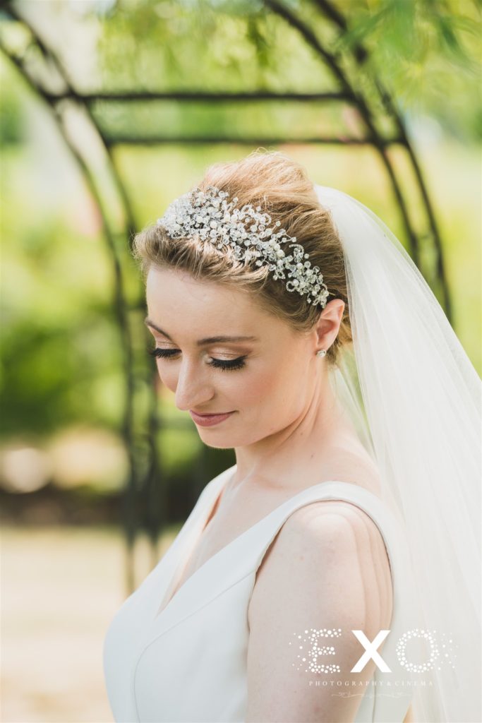 bride posing with her silver headband