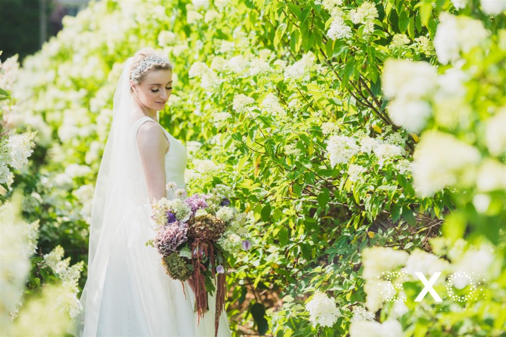 bride posing with the flowers