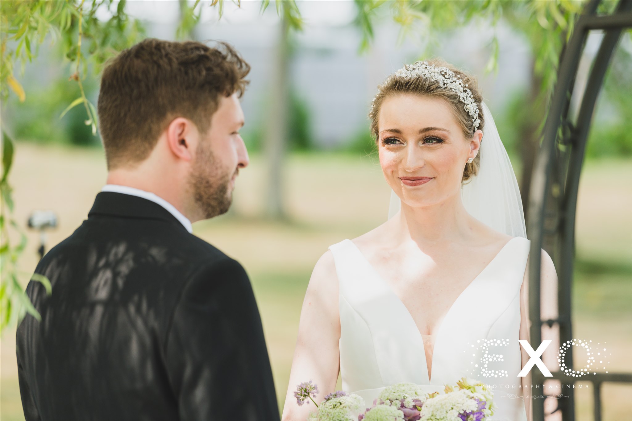 bride staring at her groom at Salt Air Farm