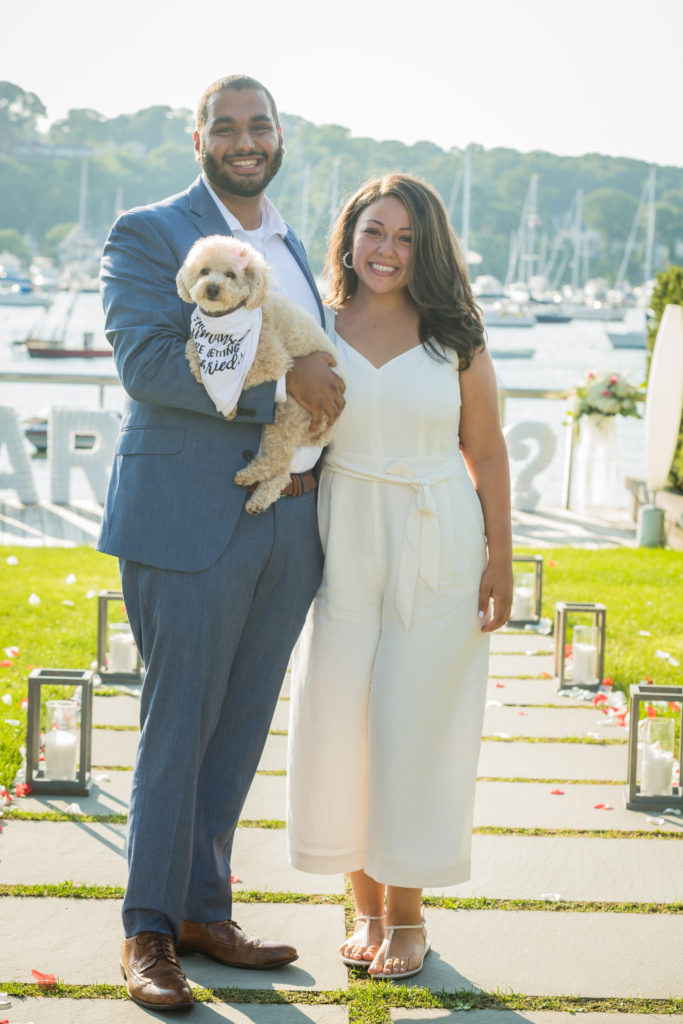 couple smiling with their dog at Harbor Club at Prime