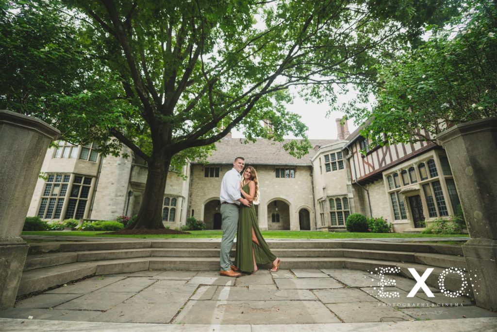 couple posing in front of the beautiful building
